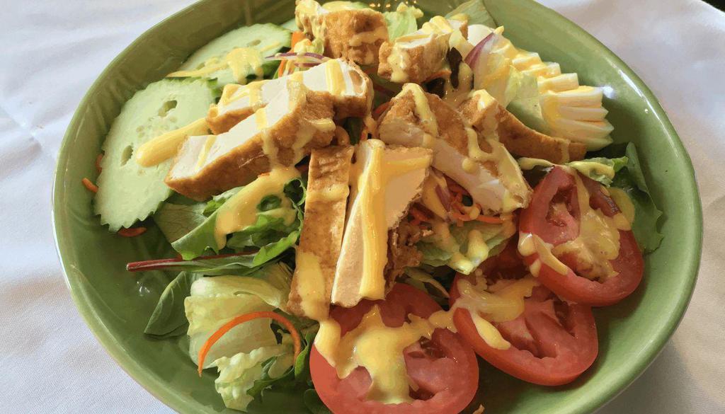 Thai Salad · A salad of lettuce, cucumbers, tomatoes, onions, egg topped with homemade honey mustard dressing.