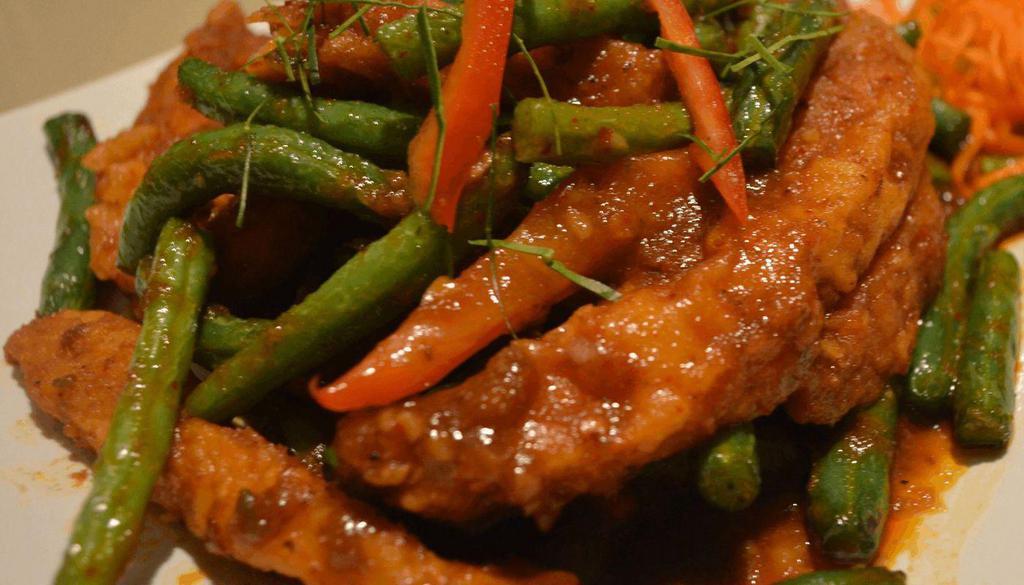 Choo Chee Catfish · Spicy Crispy catfish sautéed tasty Choo Chee paste with kaffir lime leaves, green beans and bell peppers.