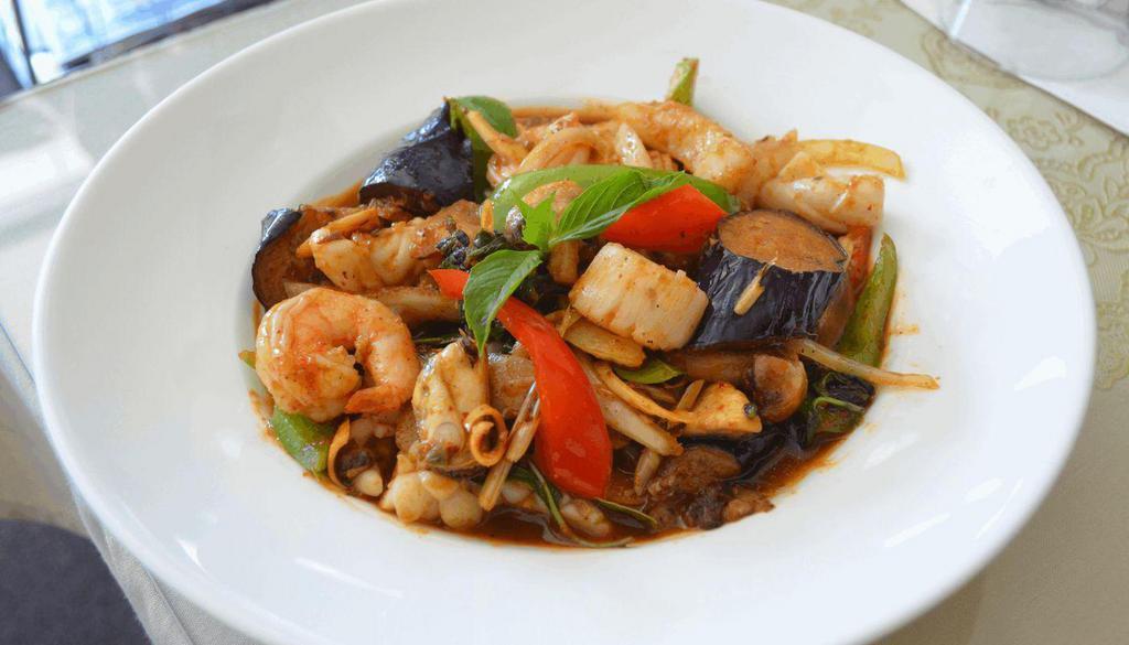 Ocean Thai Seafood (Pad Phed Talay) · Seafood combination stir-fried in red chili sauce with galangal, lemongrass, kaffir lime leaves, bell peppers, mushrooms and onions.