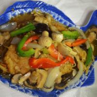 Ginger Fish · Fresh tilapia deep fried and topped with fresh ginger, onions, mushrooms and bell peppers in...