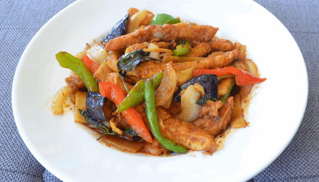 Pad Phed Catfish · Crispy catfish sautéed in spicy chili paste bamboo shoots, eggplant, onions, basil leaves and bell peppers.