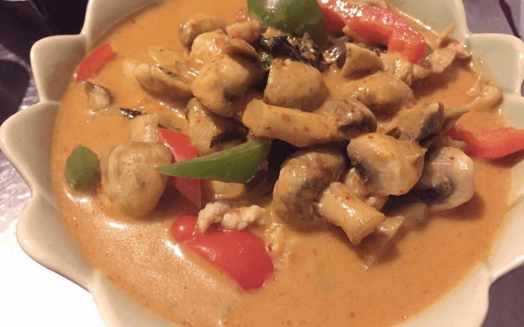 Panang Curry · Bell peppers, mushrooms, kaffir lime leaves & basil leaves in panang coconut milk curry.