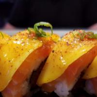 Novia Roll · Spicy. In: shrimp tempura, cucumber, and spicy tuna. Out: salmon, mango, and mango sauce.