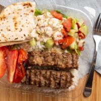 35. Adana Kebab · Minced lamb spiced with parsley, onion, charcoal grilled.