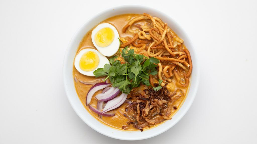N9. Curry Laksa (Curry Mee) · Spicy.  Egg noodle, in curry coconut broth, bean sprouts, tofu, boiled egg and crispy noodles.