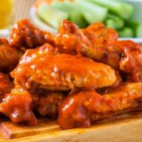Blasted Buffalo Wings · Spicy buffalo sauce mixed with batch of oven-baked chicken wings.