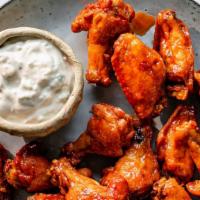 Spicy and Baked Buffalo Wings (Hot) · Served with 8 pieces. Served spicy.