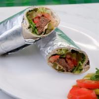 Koobideh · One skewer of ground beef with cilantro, tomato, onion, lettuce, pickle, most moosir, lavash...
