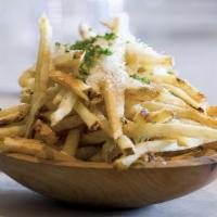 Truffle French Fries · Hand-cut Kennebec potatoes, house seasonal herbs and shaved parmesan.