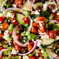 Greek Salad · Feta cheese, lettuce, tomatoes, cucumbers, parsley, sumac, fresh oregano and Greek olives, d...