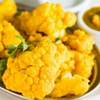 Aloo Gobhi · Cauliflower and potatoes cooked with herbs and spices.