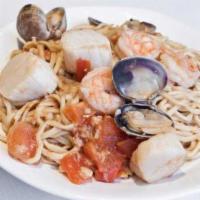 Combination Seafood Stir Fried Garlic Noodles · Prawns, scallops and clams tossed with garlic noodles.
