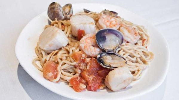 Combination Seafood Stir Fried Garlic Noodles · Prawns, scallops and clams tossed with garlic noodles.