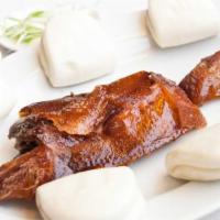 Peking Duck · Specially marinated duck, roasted to a golden brown skin. Served with steamed buns, scallion...