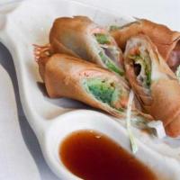 Salmon Avocado Egg Rolls (2) · Two pieces. Fried egg rolls filled with smoked salmon and avocado. Served with sweet and sou...