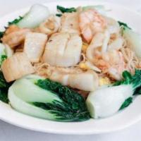 Pan-Fried Seafood Noodles · Mixed seafood tossed with fried vermicelli noodles in the house special x. O. Sauce. (does n...