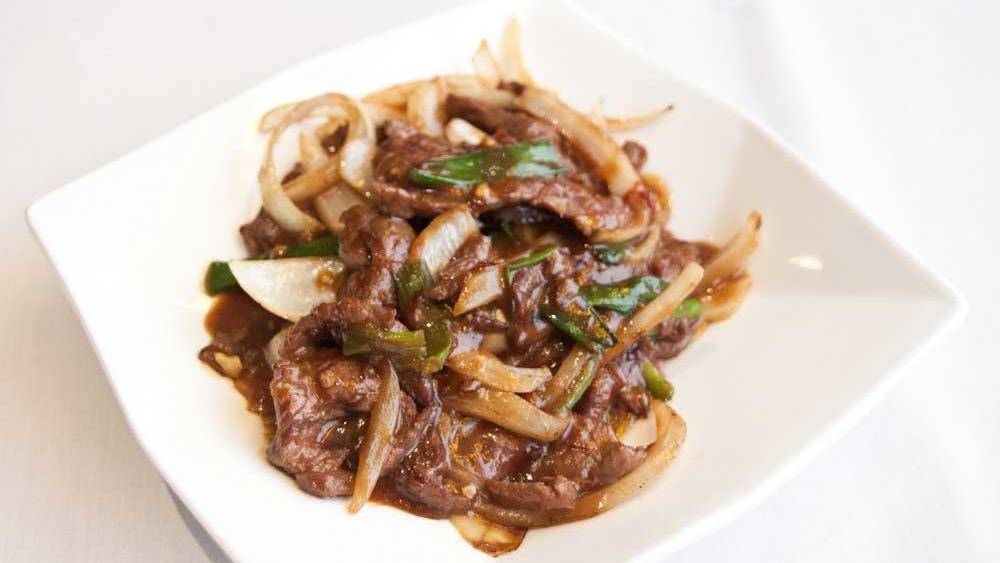 Mongolian Beef (Spicy) · Sautéed sliced beef tossed with onions and bell peppers in a spicy chili sauce.