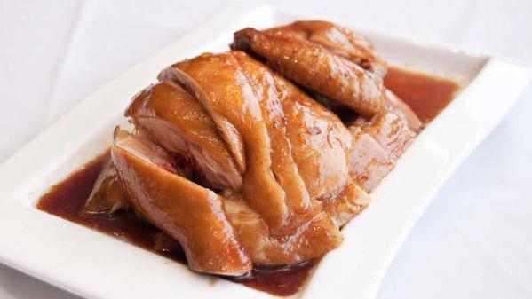 Soy Sauce Chicken (Half) · Steamed chicken served with a special soy sauce.