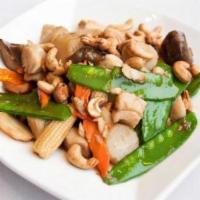 Cashew Nut Chicken · Diced chicken breast sautéed with snow peas, baby corn, bamboo shoots, carrots, onion, ginge...