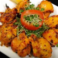 TANDOORI ACHARI CHICKEN TIKKA · Chicken cubes marinated in pickled spices, finished in clay oven