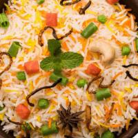 Vegetable Biryani · Mixed seasonal vegetable and saffron rice in biryani herbs served with raita and special mom...
