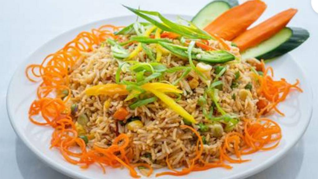 Vegetable Fried Rice · Stir fry rice with seasonal vegetables with Himalayan spices.