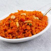 Traditional Carrot Halwa-Premium · Grated fresh carrots cooked gently in milk, sugar finished with dry coconut.