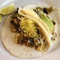 Brussels Sprout Tacos · Crispy brussels sprouts, sautéed with garlic and white wine, toasted almonds, three cheese b...