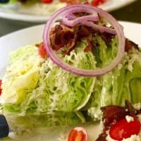 Iceberg Wedge Salad · Iceberg lettuce, crumbled bacon cherry tomato, shaved red onion housemade Pt. Reyes blue che...
