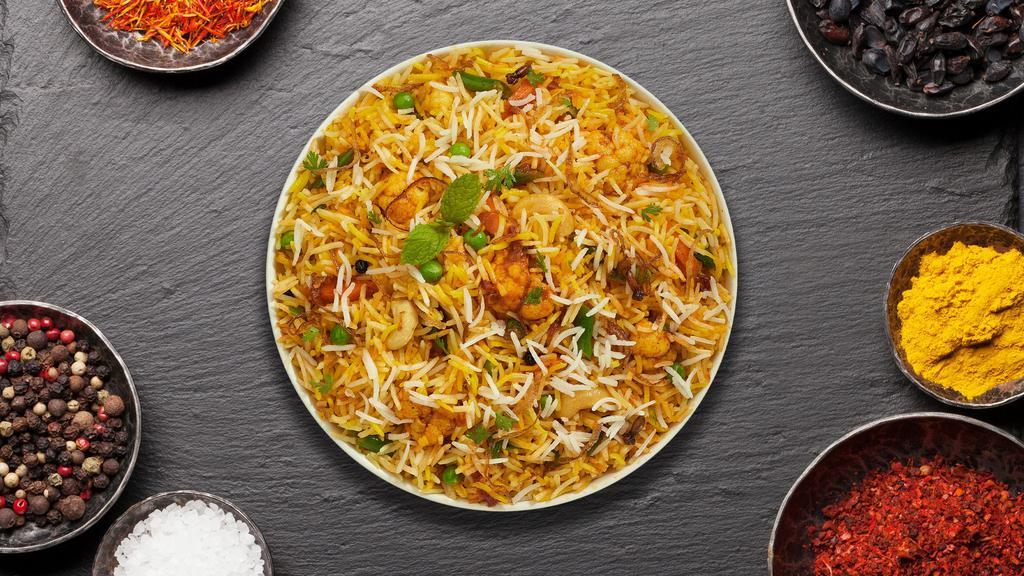 Vegetable Biryani · Spiced seasoned vegetables cooked with Indian spices and basmati rice. Served with house raita.
