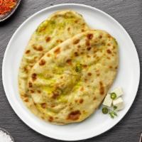 Paneer Naan · Freshly baked bread stuffed with cottage cheese cooked in a clay oven