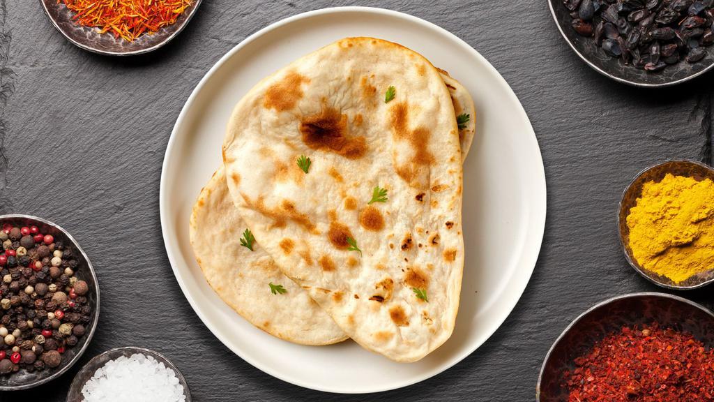 Plain Naan · All-purpose flour layered with butter baked in clay oven.