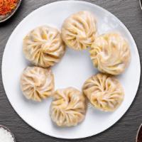 Steam Momos · Himalayan style steamed chicken dumplings served with tangy himalayan sauce.