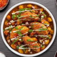 Aloo Tikki Chaat · Potato croquette served on the bed of garbanzo beans.