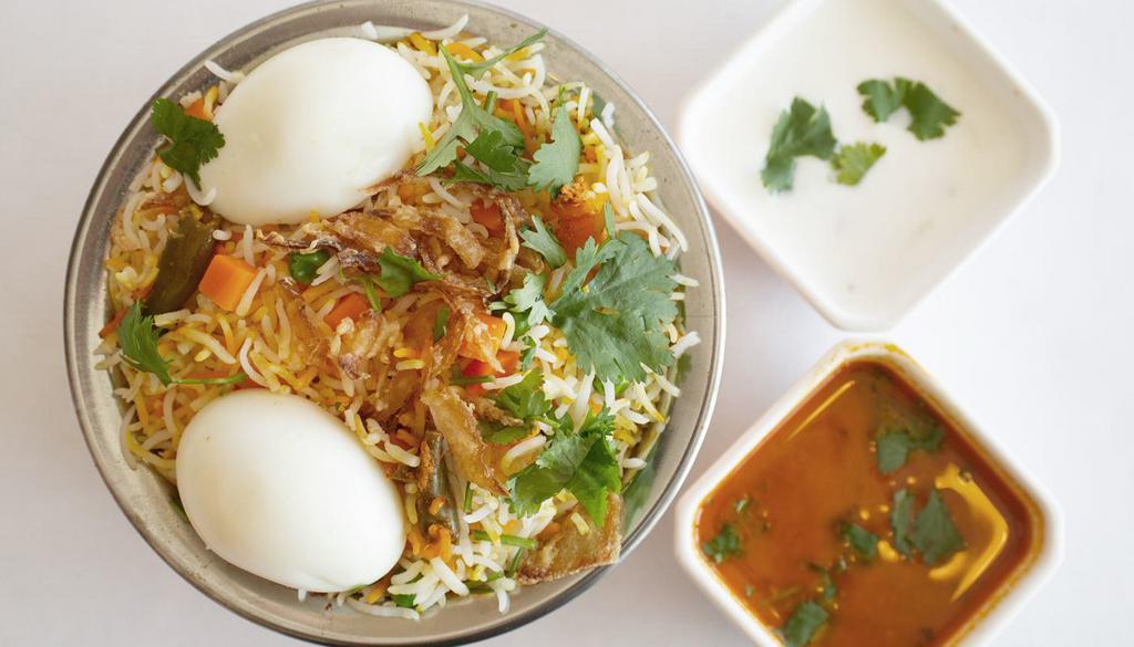 HYDERABADI EGG BIRYANI* · Egg marinated with special spices and cooked along with basmati rice.