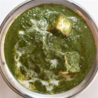 PALAK PANEER* · Creamed spinach and paneer cubes cooked to perfection with garlic and seasoning.