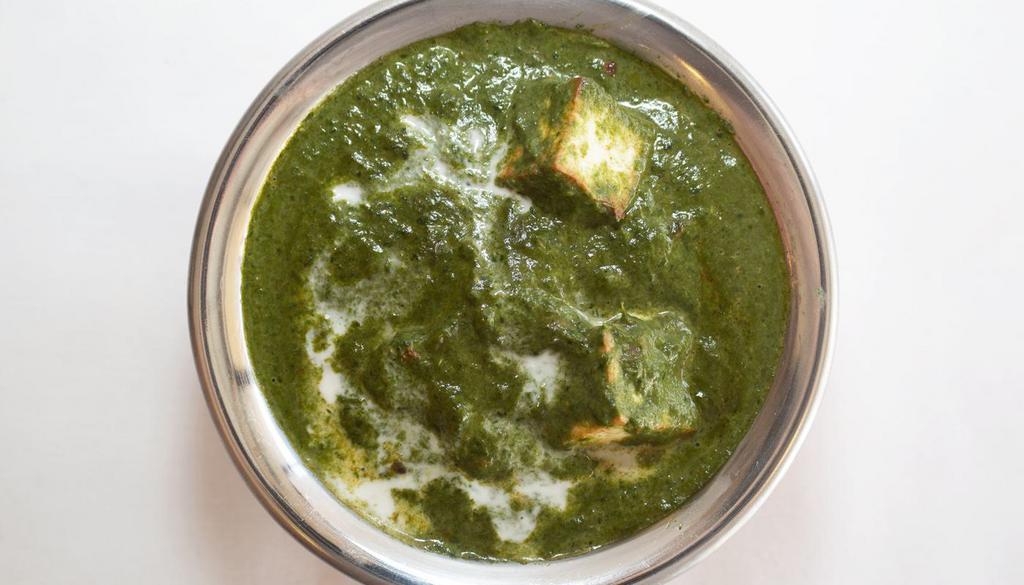 PALAK PANEER* · Creamed spinach and paneer cubes cooked to perfection with garlic and seasoning.