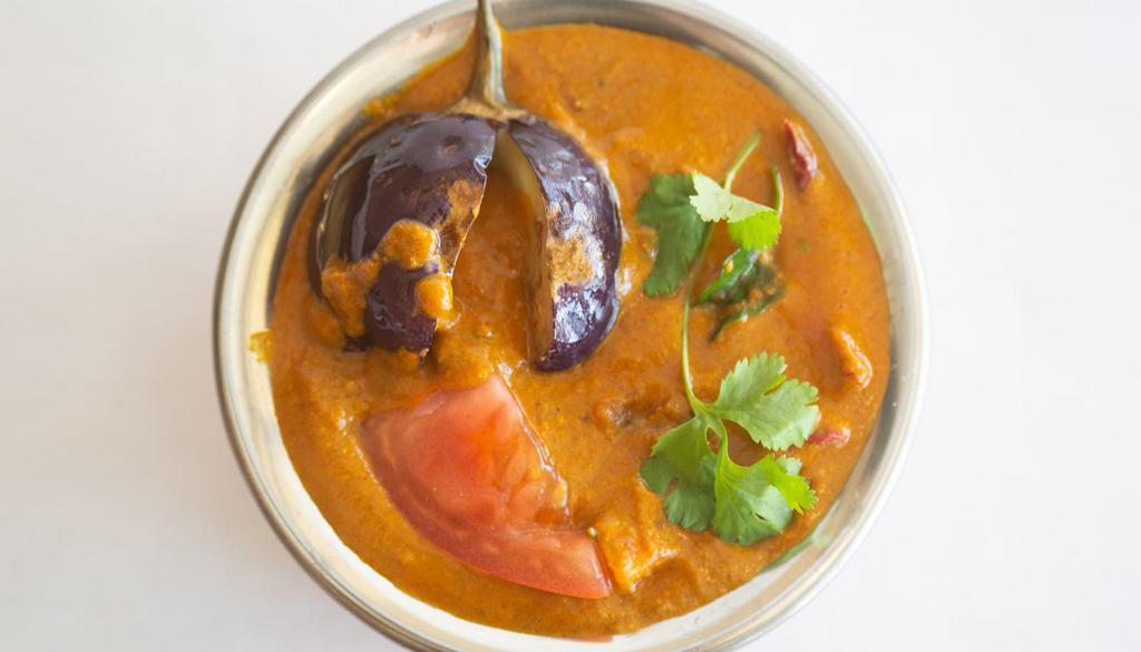 BAGARA BAINGAN* · Baby eggplant cooked with coconut-groundnut-sesame paste curry sauce.