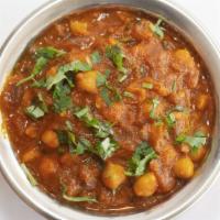 CHANNA MASALA* · Channa cooked with finely chopped onion, tomato and spices.