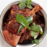 CHICKEN CHETTINAD* · Chicken cooked with coconut and chettinad region spices.