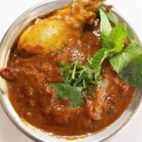 HYD CHICKEN CURRY* · Hyderabadi style chicken curry cooked with special spices.
