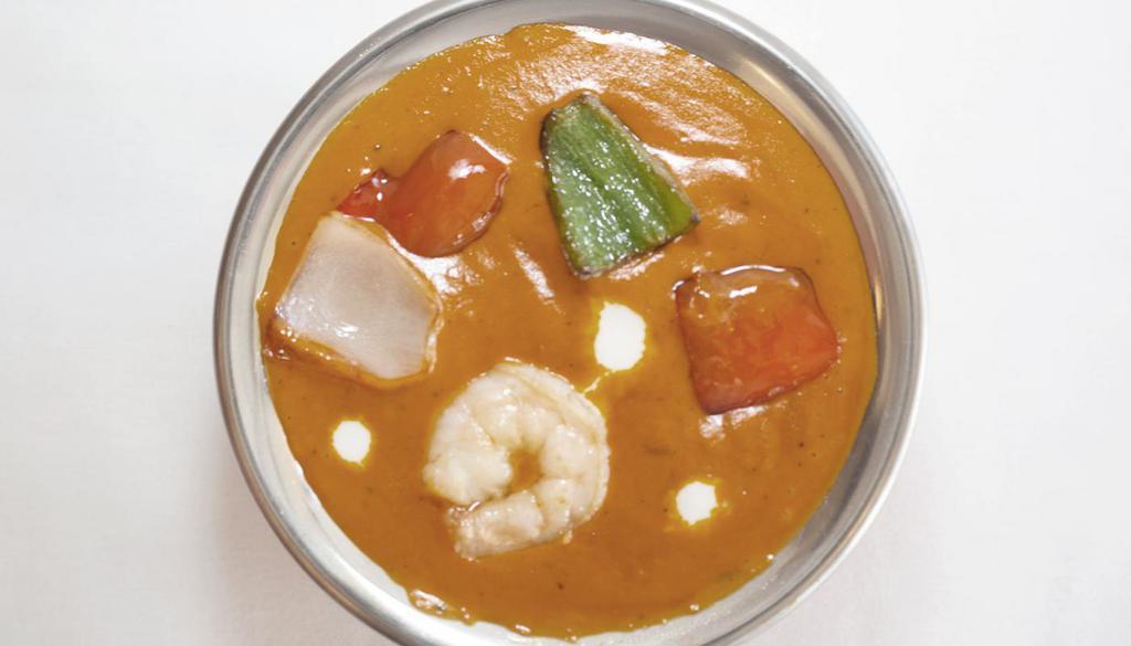 SHRIMP TIKKA MASALA* · Shrimp cooked in onion and tomato sauce with chucks of bell pepper and onions.