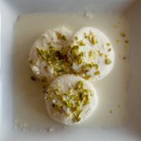 RASMALAI* · Yellow-colored flattened balls of chhena (cheese) soaked in malai (clotted cream) flavoured ...