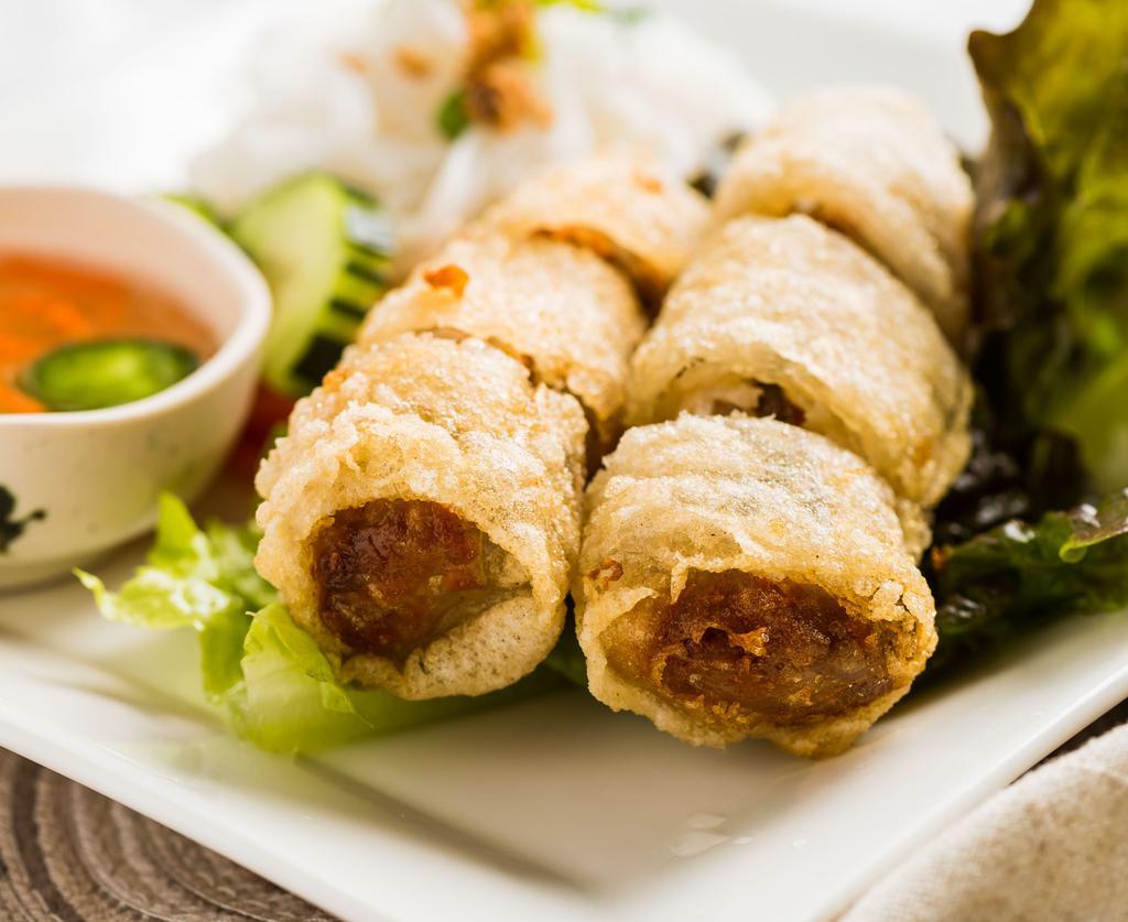 #5. Crispy Imperial Rolls · Pork meat, mushrooms, carrots and taro wrapped in rice paper, deep fried and served with fish sauce.