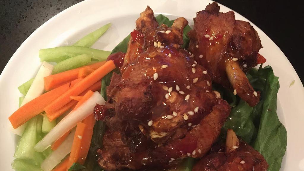 #8. Lemongrass Fried Chicken Wings · Deep fried chicken wings marinated in lemongrass sauce, served with sweet and spicy sauce and topped with sesame.