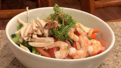 #12. Tea Plus Special Salad · Steamed prawns, slices of poached chicken, fresh lettuce, celery, carrots, tomatoes, cucumber, bean sprouts, green onions, grilled red onions, mint leaves and crushed peanuts served with fish sauce.