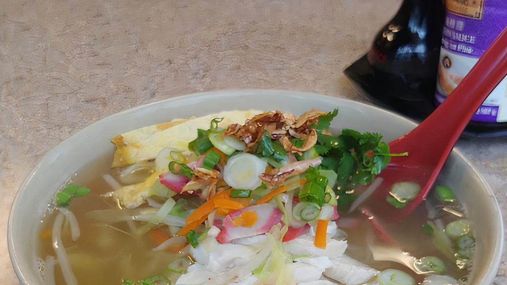 #29. Tricolor Noodle Soup · Sliced chicken, barbeque pork and pan fried egg with vegetables in Vietnamese chicken soup.
