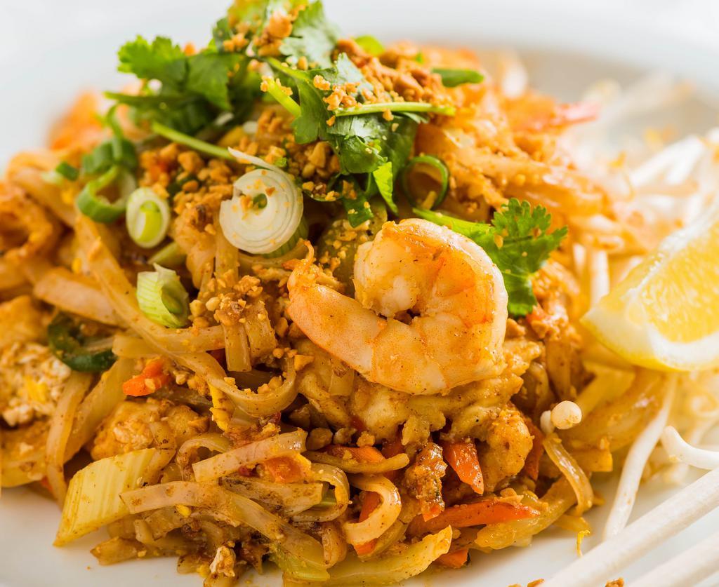 #56. Pad Thai · Spicy. Pan fried flat rice noodles, tamarind, garlic, shallot tofu, egg, bean sprouts, peanuts, scallions, and sambal, choice of chicken or prawn.