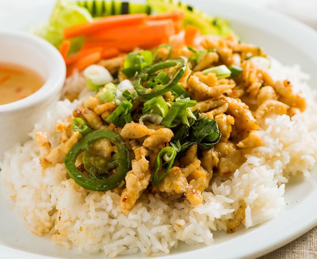 #74. Spicy Basil Chicken · Small pieces of white breast meat chicken stir fried with fresh basil leaves, served with salad.