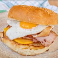 Ham Egg and Cheese Croisant · Delicious ham and cheesy cheddar eggs on a croissant.